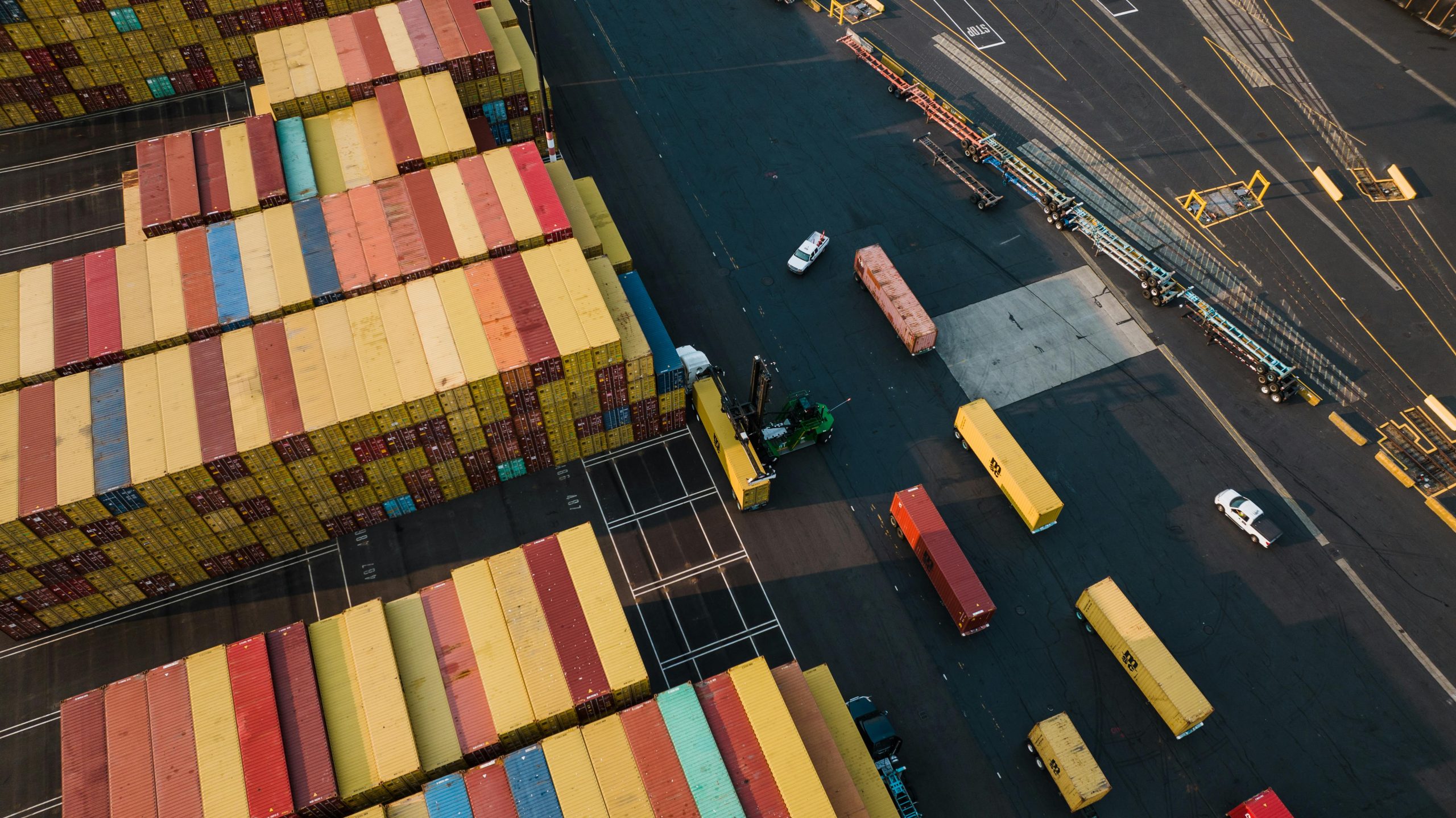 Aerial photo showing colorful cargo containers in a Seattle port, showcasing industry logistics.